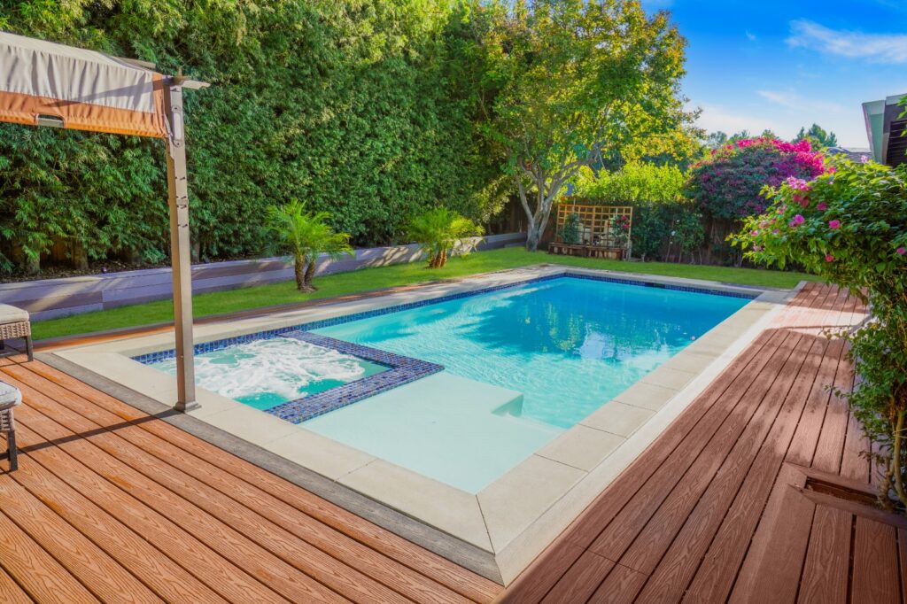 Sleek Pool with Wood Deck Design & Construction | LAX Home Inc